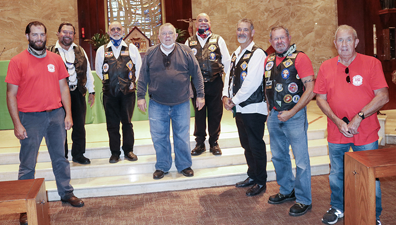 Members of Knights on Bikes pose for a picture with Archbishop Thomas Wenski after celebrating Mass at St. Martha Church Sept. 17, 2020. From left: Tony Orband, Mario Rangel, Sergio Alfonso, Archbishop Wenski, George Gutierrez, Raul Cruz Alvarez, Lance Maki and Dale Saunders. The Knights stopped at the archdiocesan Pastoral Center while riding to northern Florida along U.S. 1 to raise awareness about the rights enshrined in the First Amendment to the U.S. Constitution, notably freedom of religion and speech.