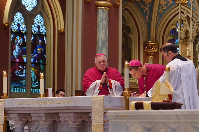 Archbishop Thomas Wenski witnesses the oath of office of Bishop-elect Stephen Parkes at vespers in the Cathedral of St. John the Baptist, Savannah, Sept 22, 2020. During his tenure as bishop of Orlando, Archbishop Wenski had named Bishop Stephen Parkes, and his brother, St. Petersburg Bishop Gregory Parkes, as pastors of two newly established parishes.