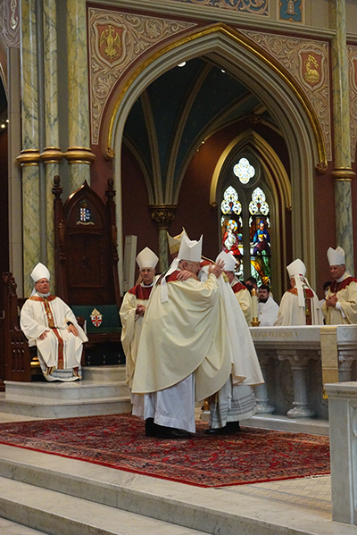 Archbishop Thomas Wenski greets newly ordained Savannah Bishop Stephen Parkes at his ordination and installation Sept. 23, 2020 at the Cathedral of St. John the Baptist in Savannah. During his tenure as bishop of Orlando, Archbishop Wenski had named Bishop Stephen Parkes, and his brother, St. Petersburg Bishop Gregory Parkes, as pastors of two newly established parishes.