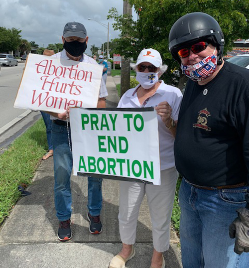 Archbishop Thomas Wenski poses with participants in the Life Chain along U.S. 1 in Miami-Dade on Respect Life Sunday, Oct. 4, 2020.