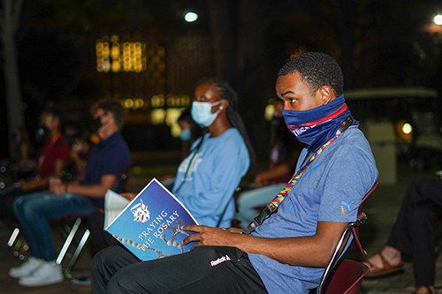 A St. Thomas University student takes part in a Rosary Rally on the feast of the Holy Rosary, Oct. 7, 2020. The rally was led and organized by the university's campus ministry office and held outside St. Anthony Chapel on campus.