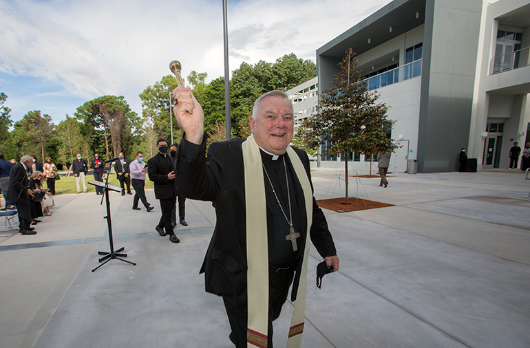 Archbishop Thomas Wenski blesses the Gus Machado School of Business complex at St. Thomas University, Oct. 16, 2020.