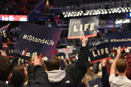 Students hold up pro-life signs before a Mass celebrated at the Capital One Arena ahead of the 2020 March for Life, Jan. 24, 2020. In his new encyclical, Fratelli tutti, Pope Francis cites wars, the “throwaway culture” that includes abortion and euthanasia, neglect of the elderly, discrimination against women, and slavery, among other threats facing humanity.