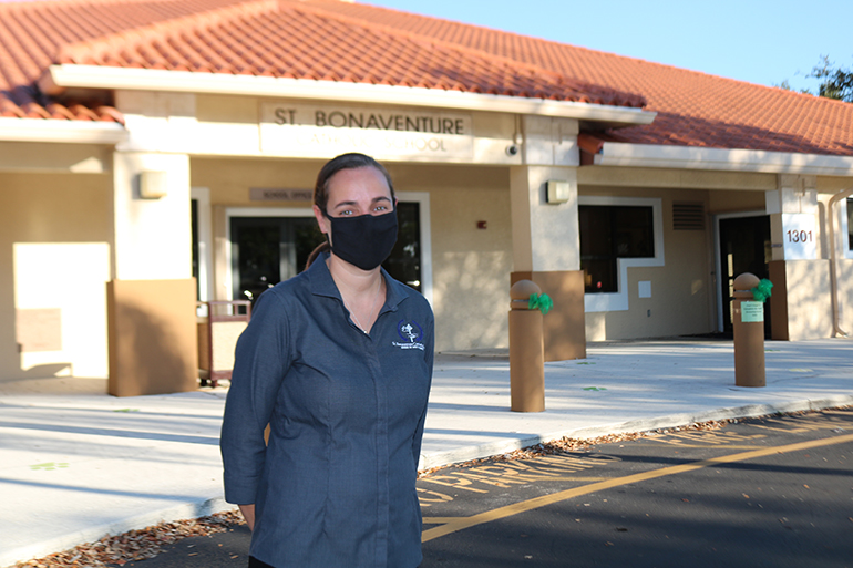 Lisa Kempinski, principal of St. Bonaventure School in Davie, stands in front of the now Blue Ribbon school, which opened its classrooms and welcomed children back at the end of September.