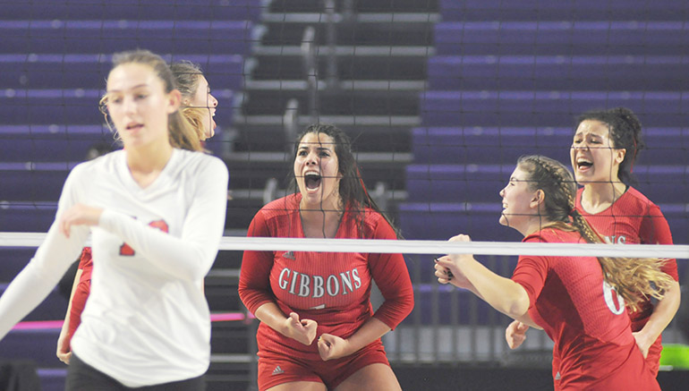 Cardinal Gibbons players Valeria Rosada (1), Fabiana Capone (6) and Dylan Andrews celebrate a point during the fourth game of the FHSAA Class 4A volleyball state final match Nov. 15, 2020 at Suncoast Credit Union Arena in Fort Myers. Bishop Kenny defeated Cardinal Gibbons 29-27, 25-18, 17-25, 25-20 to win their third state title.