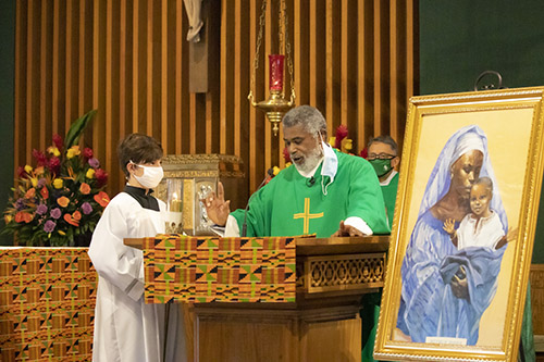 Retired Deacon Thomas Dawson, from the Office of Black Catholic Ministry, proclaims the Gospel during the Mass commemorating the feast day of St. Martin de Porres, Nov. 8, 2020. The Mass took place at St. Augustine Church in Coral Gables, and marked the start of Black Catholic History Month.