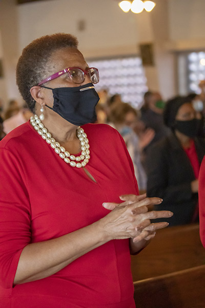 Socially distanced faithful gathered at St. Augustine Church in Coral Gables to attend the Mass commemorating the feast day of St. Martin de Porres, Nov. 8, 2020. The Mass marked the start of Black Catholic History Month.  Wearing red shirts are members of the Archdiocese of Miami's Office of Black Catholic Ministry, which helped coordinate the Mass.