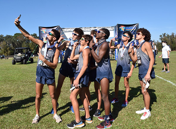 Christopher Columbus High School's cross country team take a selfie after winning their fifth state championship, Nov. 14, 2020 in Tallahassee. The team played with DQ emblems on their uniforms in memory of Danny Quesada, a Columbus cross country runner who died in 2019 at the age of 18 after a long battle with cystic fibrosis.