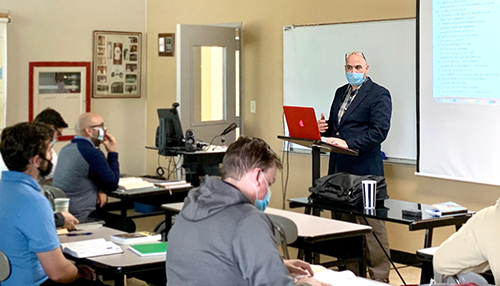 Dr. Ryan Brady, seen here teaching a class at St. John Vianney College Seminary in Miami, was instrumental in identifying the professors and providing technical support and structure to the seminary's online Master in Theology  degree program.