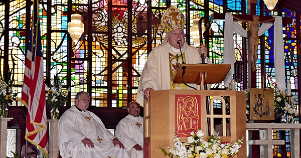 Archbishop Thomas Wenski declared Nativity Church an "oasis" for rest and renewal. Behind him are the church's parochial vicars, Father Victor Babin, left, and Father Martin Muñoz.