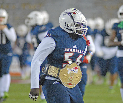 Kalunj Matthew carries the turnover belt before Chaminade-Madonna's 25-22 loss to Jacksonville Trinity Christian, Dec. 16, 2020, in the Class 3A Football Final at Bobby Bowden Field at Doak Campbell Stadium in Tallahassee.