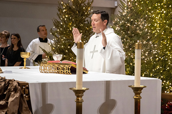 Father Richard Vigoa, pastoral administrator of St. Augustine Parish in Coral Gables, who recovered from a bout of COVID-19 in March of this year, presides at a wedding at the end of 2019.