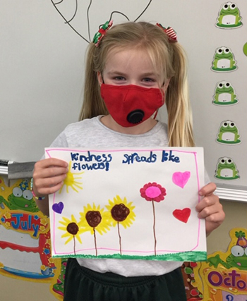 A student shows her take on how kindness spreads after taking part in Mary Help of Christians School's Anti-Bullying Week, Nov. 16-20, 2020.