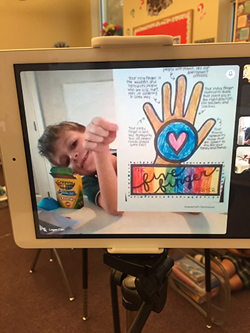 A student, learning online, shows his drawing of Pope Francis' "Five Finger Prayer" during Mary Help of Christians School's participation in Anti-Bullying Week, Nov. 16-20, 2020.