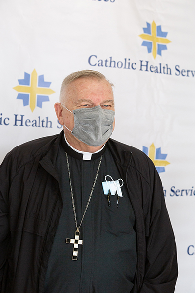 Archbishop Thomas Wenski waits to receive one of the first doses of a COVID-19 vaccine when Florida state public health officials rolled it out Dec. 16, 2020 at St. John's Nursing Center in Fort Lauderdale, part of Catholic Health Services of the Archdiocese of Miami. Staff and residents of the facility were offered the Pfizer-BioNTech COVID-19 vaccine, which the U.S. Food and Drug Administration authorized for emergency use Dec. 11, 2020.