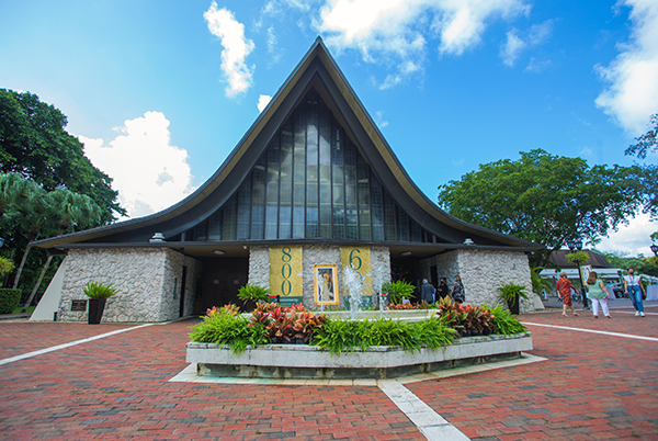 Exterior view of St. Hugh Church, which was designed by parishioner and Miami architect Murray Blair Wright with monastic simplicity, inspired by St. Hugh’s life as a Carthusian monk. Archbishop Thomas Wenski celebrated the Coconut Grove parish's 60th anniversary Mass Nov. 15, 2020.