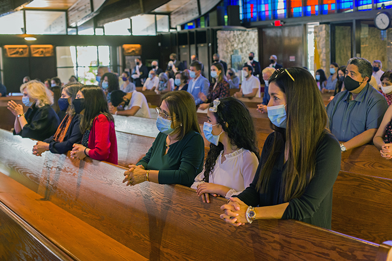 Parishioners take part in St. Hugh Church's 60th anniversary Mass, celebrated by Archbishop Thomas Wenski Nov. 15, 2020.