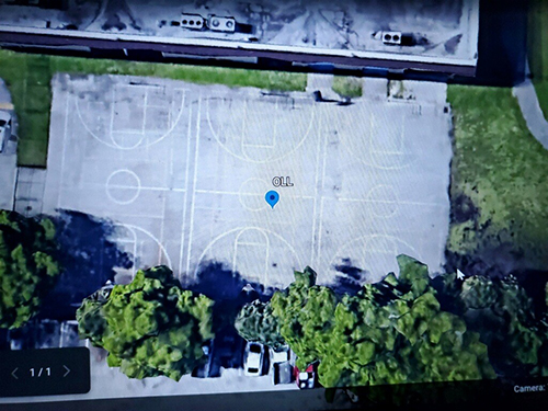Aerial view of the basketball courts at Our Lady of the Lakes School in Miami Lakes before the refurbishment effort spearheaded by Columbus High senior and newly minted Eagle Scout William Dunkley, Jr.