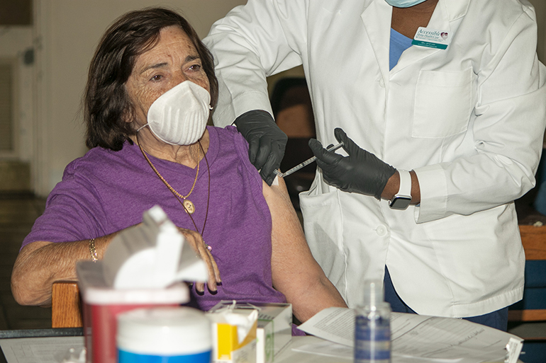 Reina Rodriguez, 85, a parishioner of St. John the Apostle in Hialeah, gets her first dose of Moderna's COVID-19 vaccine at San Lazaro Church in Hialeah, Jan. 20, 2021. San Lazaro became the first archdiocesan church to serve as a COVID-19 vaccination site, serving a total of 700 Hialeah and Hialeah Gardens residents age 65 and older, including 150 San Lazaro parishioners. The state-supported distribution was organized by Miami-Dade County Commissioner Rene Garcia, who represents the area.