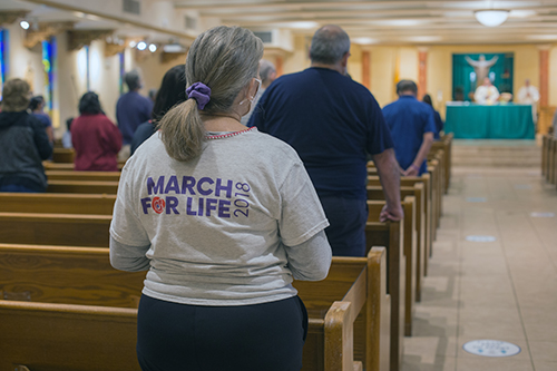 Blessed Trinity parishioners and others celebrate Mass before taking part in a Prayer Walk For Life along Curtiss Parkway in Miami Springs, Jan. 23, 2021.