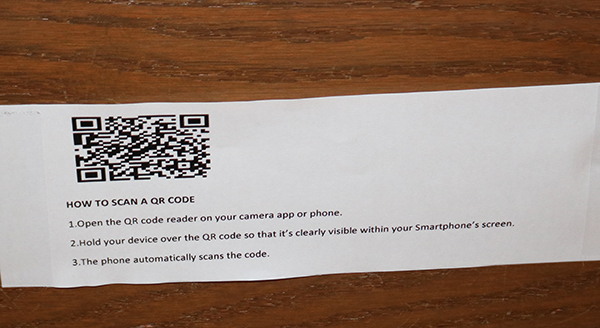 Pews at St. Pius Church X in Fort Lauderdale include barcodes to help parishioners participate more fully in Mass during the COVID-19 pandemic.