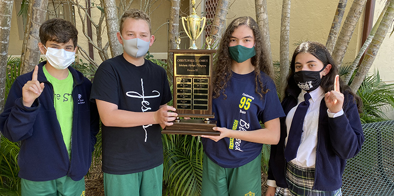 St. Theresa students proudly pose with the XLII Columbus Scholastic Olympics trophy; from left: Lucas Perez Soto, Gabriel Fernández, Emily Bobadilla and Sofía Rodríguez.