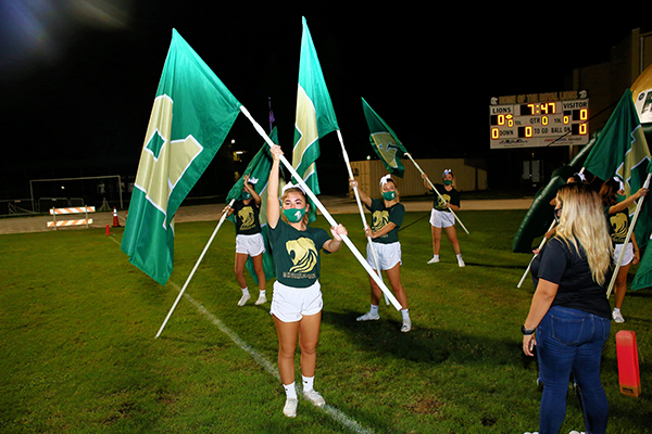 Immaculata-La Salle cheerleaders do their routines to support the school's football team at the homecoming game, which was also the cheerleaders' senior night. Due to COVID-19, it was one of the few times this year that the cheerleaders were able to perform at games.