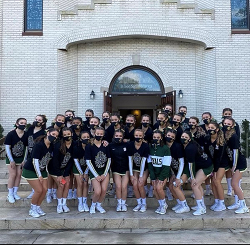 Moments before entering the state finals competition, Immaculata-La Salle's cheerleaders stopped by St. Joseph Church in Lakeland.