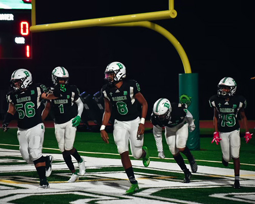 St. Brendan High players get off the field during an Oct. 23, 2020 game against Somerset Academy South Homestead, which St. Brendan won 48-7.