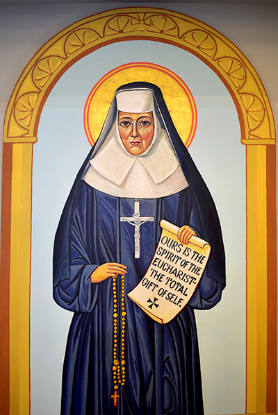 The patroness of St. Katharine Drexel Church stands to the right of the chancel. The 19th century educator combined prayerfulness with ministry to the disadvantaged.