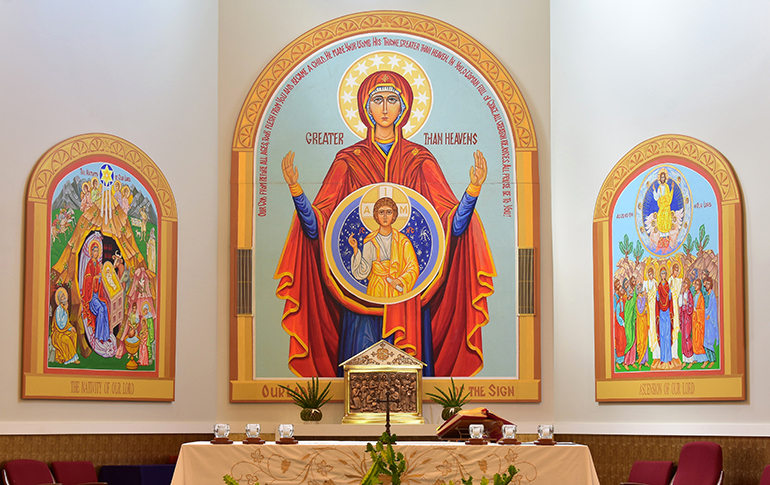 Three icons share the chancel area at St. Katharine Drexel Church. The central double icon, Our Lady of the Sign, is based on the belief that while Mary was pregnant with Jesus, her womb itself was a holy sanctuary.