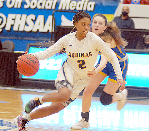 St. Thomas Aquinas guard Maya Williams drives past Charlotte's Adriana Iorfida during the second half of St. Thomas Aquinas' 62-48 victory over Punta Gorda Charlotte on Thursday, Feb. 26, 2021, in the FHSAA Class 6A girls basketball state semifinals at the RP Funding Center in Lakeland.