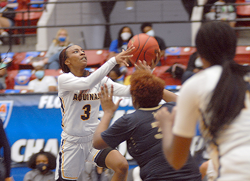 St. Thomas Aquinas senior Samara Spencer (3) goes for a layup against Wekiva defenders during the third quarter of St. Thomas Aquinas' 62-60 victory over Wekiva in the FHSAA Class 6A girls basketball championship game Saturday, Feb. 27, 2021, at the RP Funding Center in Lakeland. Spencer had 17 points to help the Raiders win their first championship.