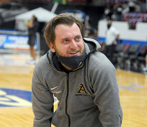 St. Thomas Aquinas coach Oliver Berens celebrates his team's 62-60 victory over Wekiva in the FHSAA Class 6A girls basketball championship game Saturday, Feb. 27, 2021, at the RP Funding Center in Lakeland. The Raiders won their first championship.