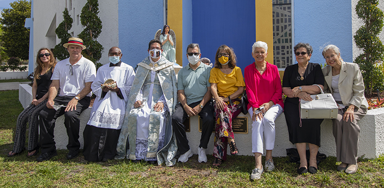 After the dedication of the new Respect Life Prayer Garden Feb. 28, 2021, Father Alfredo Rolon, parochial administrator at St. Malachy Church in Tamarac, poses with members of the parish's Mary for Life Respect Life group.