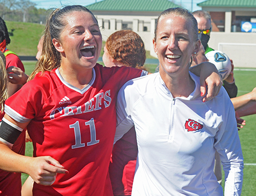 Senior Heather Astle, left, and coach Margo Flack celebrate Cardinal Gibbons' 2-0 victory over Panama City Beach Arnold in the FHSAA Class 4A girls soccer championship game March 3, 2021, at Spec Martin Stadium in DeLand. The Chiefs won their first girls soccer championship.