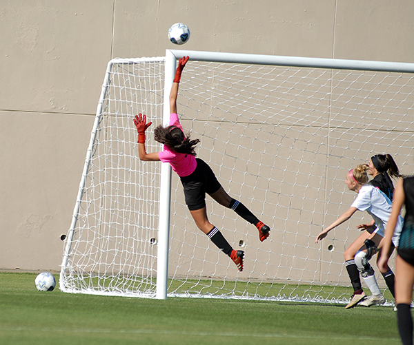 Archbishop McCarthy goalkeeper Paloma Pena swipes the ball away from the goal during the first half of Archbishop McCarthy's 2-0 loss to Ponte Vedra, March 5, 2021 in the FHSAA Class 5A Girls Soccer Championship Game at Spec Martin Stadium in DeLand.
