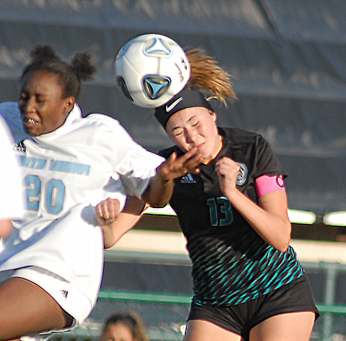 Archbishop McCarthy's Jessica Gonzalez, right, heads the ball away from Ponte Vedra's Kaylan Heinz during the first half of Archbishop McCarthy's 2-0 loss to Ponte Vedra, March 5, 2021  in the FHSAA Class 5A Girls Soccer Championship Game at Spec Martin Stadium in DeLand.