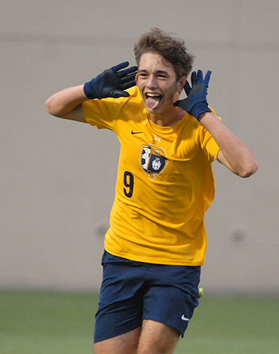 Belen Jesuit's Matias Perinot celebrates his tying goal during the second half of the Belen Jesuit Wolverines' 2-1 overtime victory over the Tampa Jesuit Tigers, March 6, 2021 in the FHSAA Class 5A Boys Soccer Championship Game at Spec Martin Stadium in DeLand.