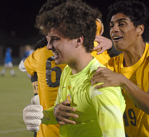 Goalkeeper Jack Volpe, left, and Collin Pallissery celebrate the Belen Jesuit Wolverines' 2-1 overtime victory over the Tampa Jesuit Tigers, March 6, 2021 in the FHSAA Class 5A Boys Soccer Championship Game at Spec Martin Stadium in DeLand.