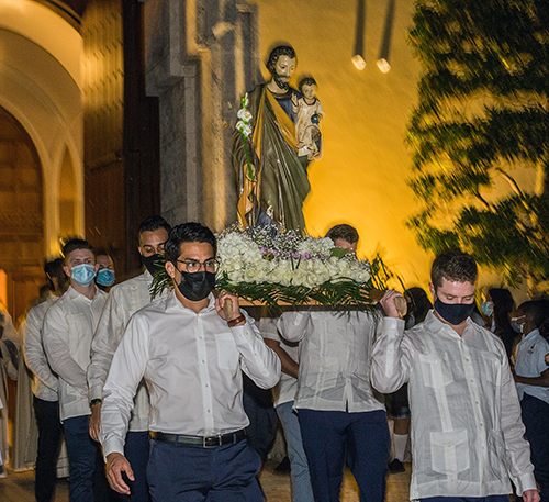 Brian Ayala, Cody Nelson, Anthony Paz and Ray Camacho carry a statue of St. Joseph out of St. Mary Cathedral to Northwest Second Avenue where a short procession took place on his feast day, March 19, 2021.