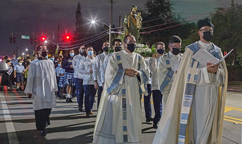 Father Christopher Marino, rector of St. Mary Cathedral, leads the procession with the statue of St. Joseph through the streets surrounding the church to mark the Year of St. Joseph on his feast day, March 19, 2021.