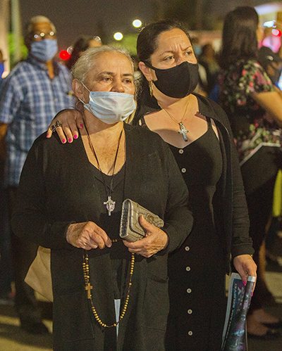 Sonia Cristancho walks in procession with her mother, Maria Cristancho, during the procession on the streets surrounding St. Mary Cathedral which took place on St. Joseph's feast day, March 19, 2021.