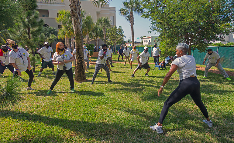 Shebah Carfagna, a health, wellness and fitness instructor with Panache Fitness Company, leads Camillus House clients in exercises during Fit 'n Trim day, March 24, 2021.