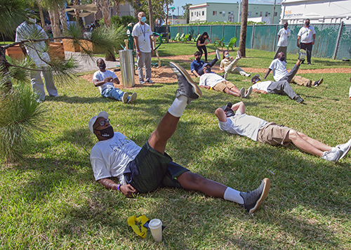 A Camillus House client exercises with others in the renovated courtyard during Fit 'n Trim day, March 24, 2021.