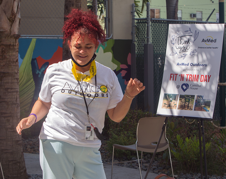 Coralia Serrano, a Camillus House client, dances to DJ Lu's music during Fit 'n Trim day, March 24, 2021.