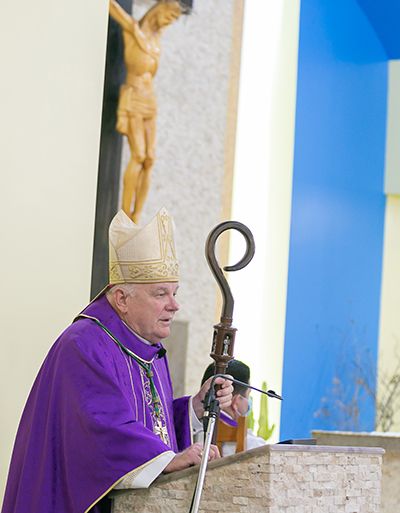 Archbishop Thomas Wenski preaches the homily congratulating Catholic Charities on its 90th anniversary,  March 26, 2021 at St. Joachim Church in Miami.