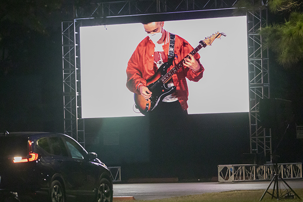 Organizers set up a drive-in style simulcast which allowed attendees to listen, watch, and tailgate from their vehicles during the EPIC Night of Mercy at St. Thomas University in Miami Gardens, April 10, 2021.