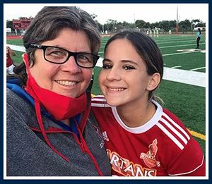 Valarie Lloyd, dean of students at Msgr. Edward Pace High School, takes a selfie with one of her students. She is also moderator of all athletics in the Archdiocese of Miami and has instituted Play Like a Champion training for coaches and athletes' parents throughout the archdiocese.