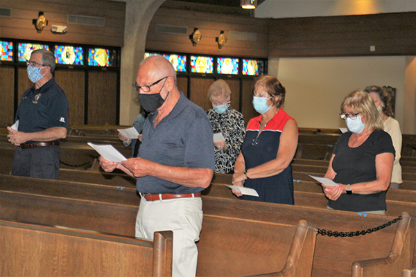 Members and guests of Serra Club of Broward County attend a vocation Mass followed by talks April 10, 2021 at host St. Gabriel Church in Pompano Beach. Shown in the front pew is Malcolm Meikle, president of the Serra Club of Broward County, who was on hand and welcomed everyone along with his wife, Georgette Meikle.